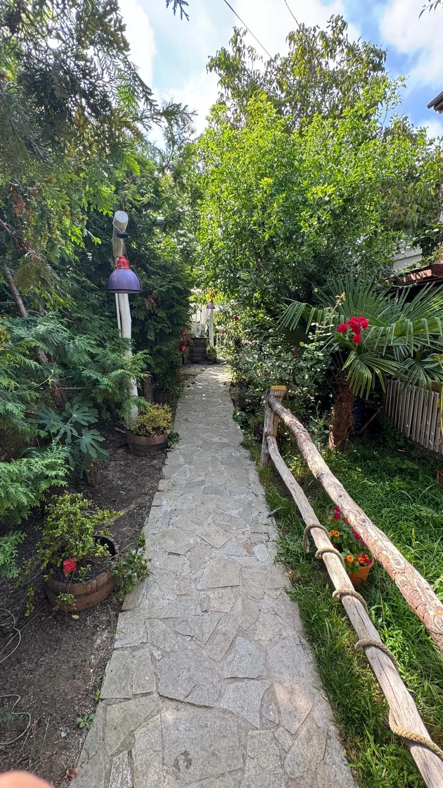 Garden path and exterior view of Hacienda Shopa