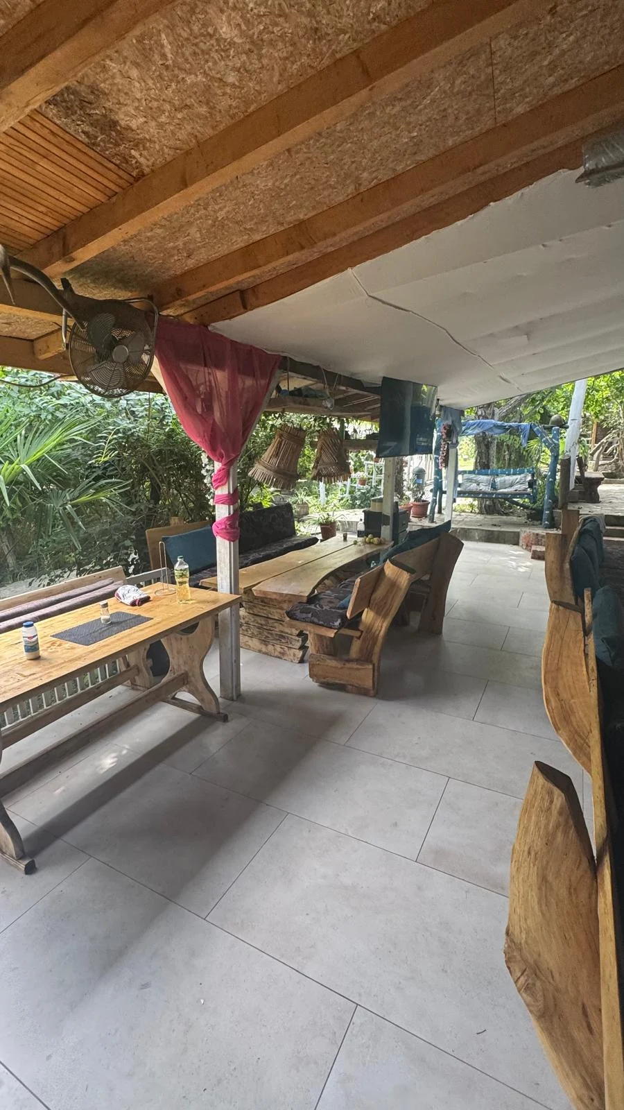 Covered outdoor living area with seating