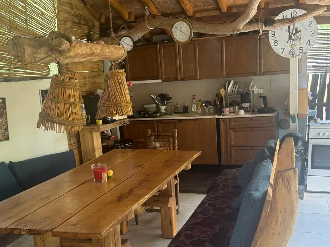 Rustic outdoor kitchen and large dining table